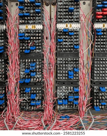 Fiber optical network cables panel. Old telephone cross connection box.