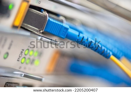 Fiber Optical Patch Cord Cables Connected to Optic Ports of Switch Macro View