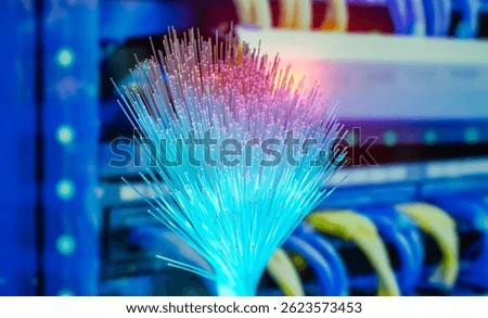 Fiber optics network cable on technology background