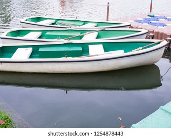 Fiberglass Boats Floating On The Pool