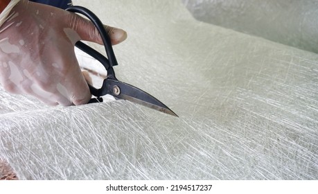 Fiberglass Material Cutting By Scissors Close Up View