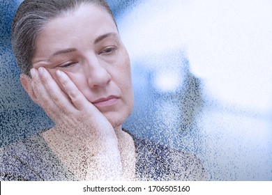Fibromyalgia or chronic fatigue syndrome: exhausted woman falling asleep in the office, particle dispersion effect.