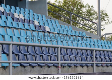 A field of empty seats in a open stadium