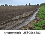 Field erosion of soil by water in nature agriculture landscape damage of environment