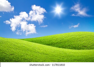 Field Of Green Grass And Blue Sky