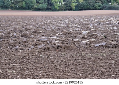 The Field Has Been Ploughed By The Tractor Prepare For Planting Wheat In The Farm In The UK England 