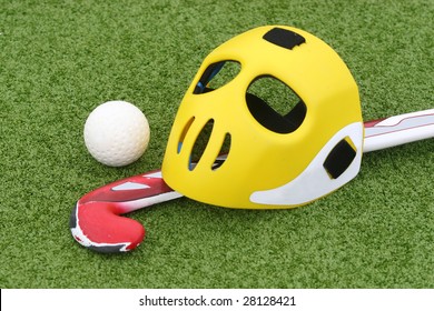 Field Hockey Equipment On Green Grass