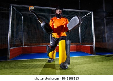 Field hockey goalie at the net ready to defense. - Powered by Shutterstock