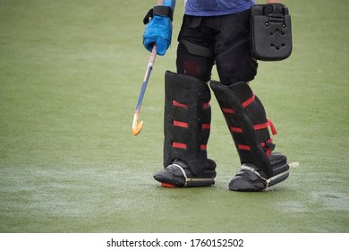 Field hockey goalkeeper on a green grass. - Powered by Shutterstock