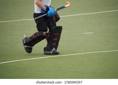 Field hockey goalkeeper on a green grass. - Powered by Shutterstock