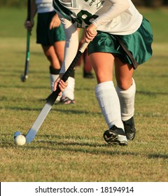 Field hockey player with ball