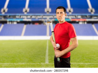 field hockey player posing wing camera in a stadium - Powered by Shutterstock