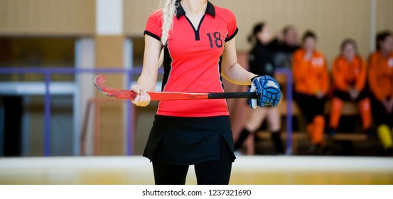 Field Hockey Player, In Possesion Of The Ball, Running Over An Astroturf Pitch, Looking For A Team Mate To Pass To