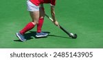 Field Hockey player, ready to pass the ball to a team mate. Horizontal sport theme poster, greeting cards, headers, website and app