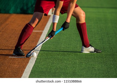 Field Hockey player, ready to pass the ball to a team mate