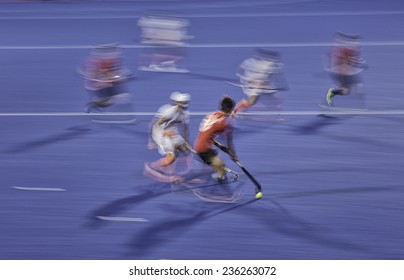 Field hockey players fight for a ball