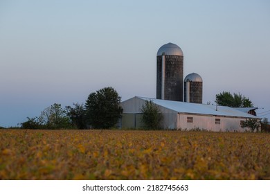 A Field Leads To Two Silos In Rural Missouri.