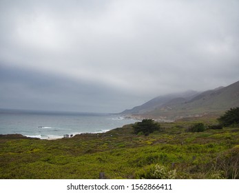 a field with a mountain in the background