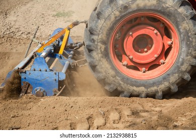 Field Preparation By Rotary Tiller Tractor