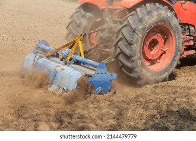 Field Preparation By Rotary Tiller Tractor