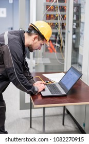 Field service engineer inspect relay protection system with laptop computer. Bay control unit. Medium voltage switchgear - Shutterstock ID 1082270915