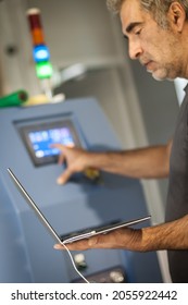 Field Service Maintenance Engineer Technician Electrician Inspect And Control Machine Hardware And Software System With Laptop Computer. Electric Installation