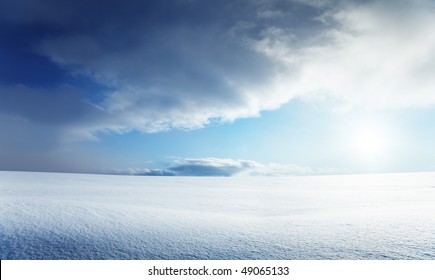 field of snow and cloudy sky - Powered by Shutterstock