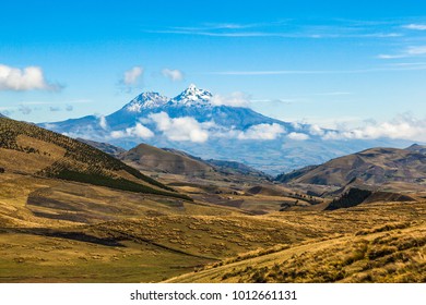 Fields cultivated in summer with Ilinizas volcano in the background