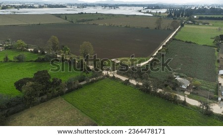 Fields of green grass between stone wall fences. offroad. Aerial top down view on the meadow colombia LatinAmerica
