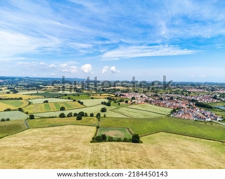 Fields and houses in Somerset, England, from a drone