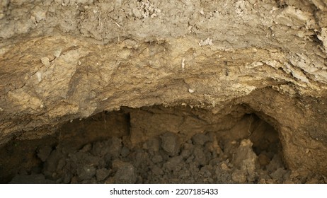 Fields subsoil erosion damage hole pit soil inappropriately managed earth land degradation field. Intensive agriculture damages tractor track. Vadose zone poor farm farming without trees draws. - Shutterstock ID 2207185433