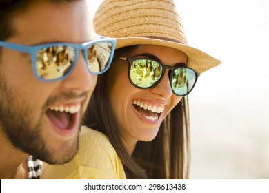 Fiends having a great time together at the beach bar - Powered by Shutterstock