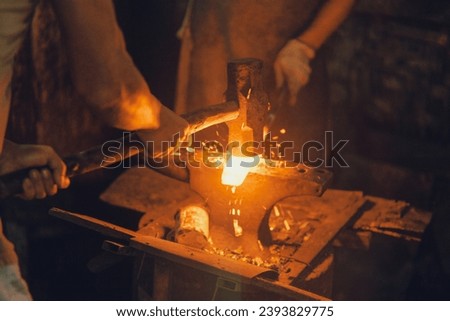 Fierce flames dance, forging raw steel into art. In the blacksmith's realm, craftsmanship is born from fire and skill. A mesmerizing dance of strength and precision.