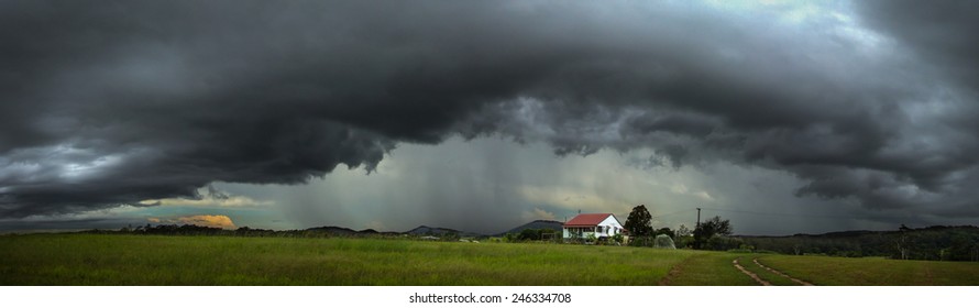 A Fierce Storm Cell Passes Over A Small Farm House