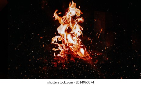 Fiery dance: A mesmerizing bonfire captured in pixels. Flickering flames, warmth embraced—nature's elemental poetry for your visual allure. 