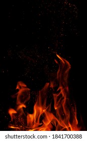 Fiery flame with sparks on a black background. Texture (element) for barbecue or cooking. - Shutterstock ID 1841700388