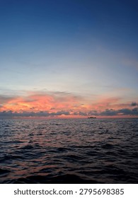 Fiery Orange Sunset Reflection Over Calm Ocean Waves

Stunning ocean sunset with dramatic fiery orange clouds reflecting on the water surface during a peaceful evening.