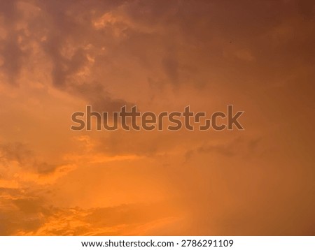 Fiery orange sunset sky with dramatic clouds and cinematic glow, captured in soft wide-angle focus. Ideal for luxury branding, emotional ads, wellness visuals and aesthetic backgrounds.