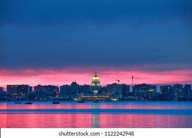 Fiery Pink sunset over Madison Wisconsin view from across Lake Monona