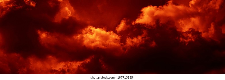 Fiery red dramatic sky. Fire, war, explosion, catastrophe, flame. Horror concept. Web banner. Wide Bloody red background with copy space for design. Panoramic.                            