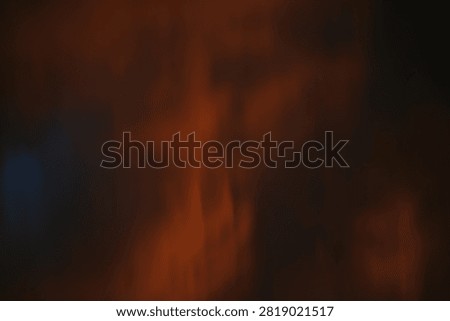 Fiery Red Orange Dramatic Clouds In Sunset Sky Background. Fiery red and orange dramatic clouds in the sky during intense sunset. Moody and dramatic atmosphere. Perfect for background, weather, nature and apocalyptic concept. High resolution.