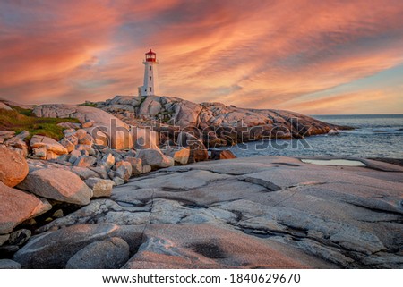 A fiery sky over the lighthouse at Peggy’s Cove in Nova Scotia