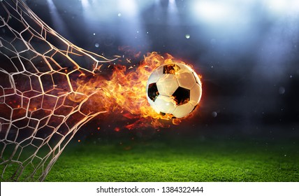 Fiery Soccer Ball In Goal With Net In Flames
