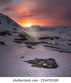 Fiery Sun Illuminates A Valley In Winter. Peaceful Italian Snowy Landscape