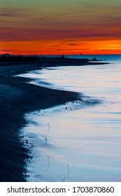 Fiery Sunset Along A Lake Michigan Shoreline.