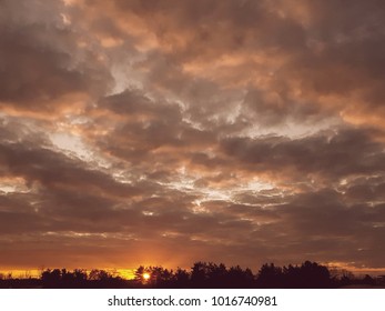 Fiery sunset with beautiful clouds in the sky.