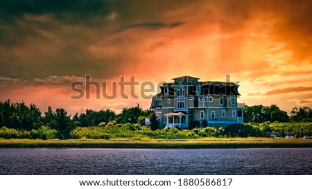 Fiery sunset engulfs a large beach house in Cape May, NJ. 