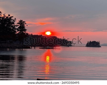 A fiery sunset reflected on Roche Harbor