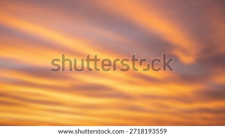 Fiery Sunset Sky with Dramatic Colors and Cloud Streaks Atmospheric and vibrant.