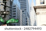 Fifth avenue, 5 ave road sign, Manhattan midtown highrise skyscraper architecture, New York City 5th av, 42 street corner near Bryant Park, Library. Traffic crossroad signage, USA. Chrysler Building.